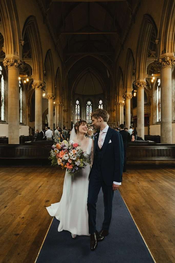 Close-up of Rachel’s wedding dress in St Mary’s Church