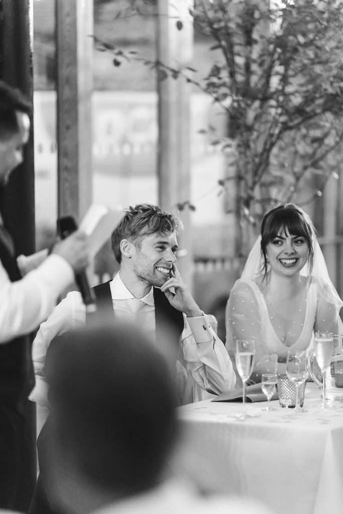 Guests seated at tables at The Glass House Hackney.